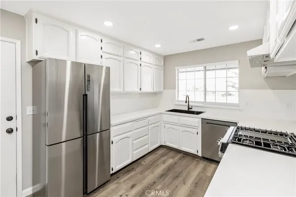 a view of cabinets and window