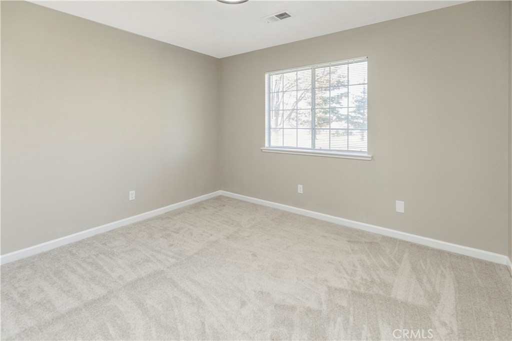 28702 Rancho Avenue Madera, CA 93638 - Photo 16 of 34 an empty room with a window