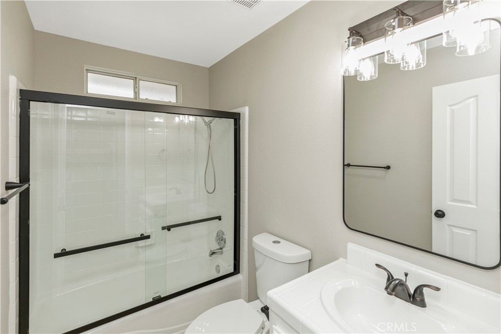 28702 Rancho Avenue Madera, CA 93638 - Photo 20 of 34 a bathroom with a sink toilet and shower