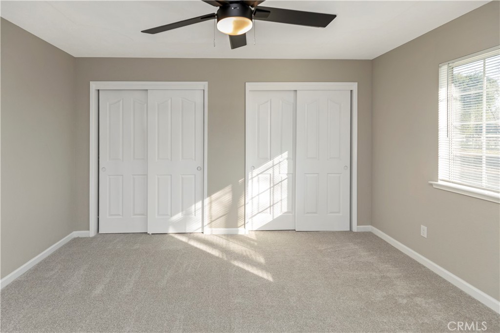 28702 Rancho Avenue Madera, CA 93638 - Photo 26 of 34 a view of empty room with windows