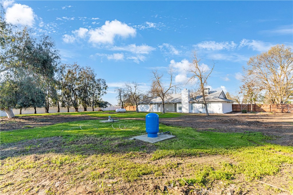 28702 Rancho Avenue Madera, CA 93638 - Photo 33 of 34 a front view of a house with a yard