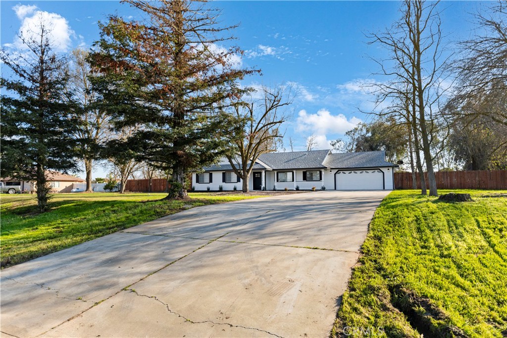 28702 Rancho Avenue Madera, CA 93638 - Photo 4 of 34 a view of a house with a yard