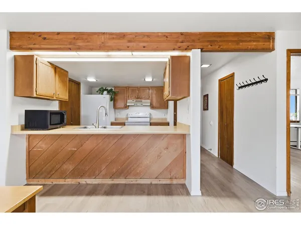 a bathroom with a sink vanity granite and toilet