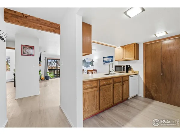 a kitchen with stainless steel appliances granite countertop a stove a refrigerator and a sink