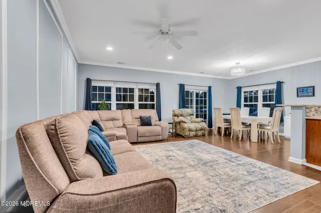 a living room with furniture rug and window