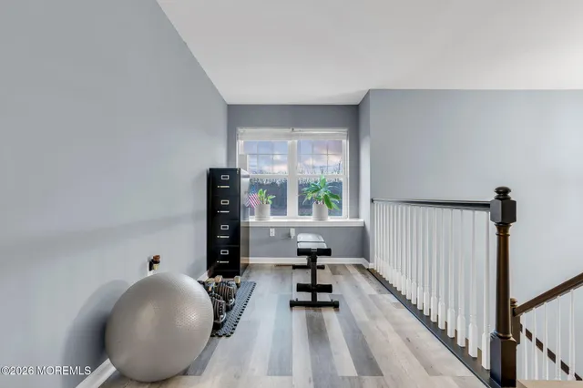 a view of a living room and workspace