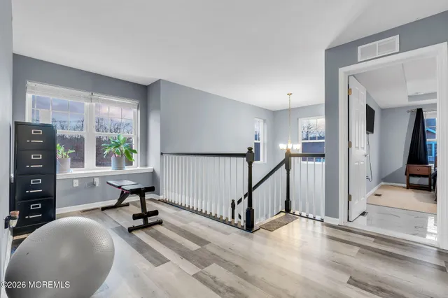 a view of a livingroom with furniture and a window