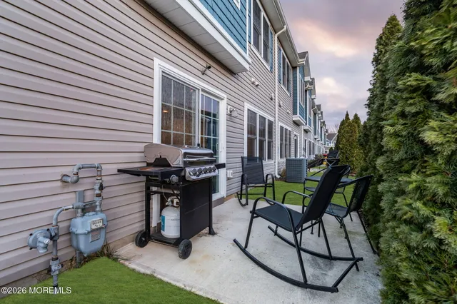 a view of a chairs and table in a patio
