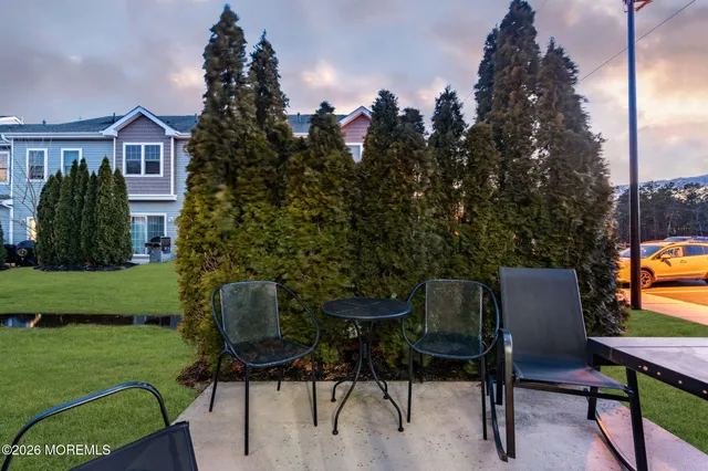a view of a chairs and table in patio of the house