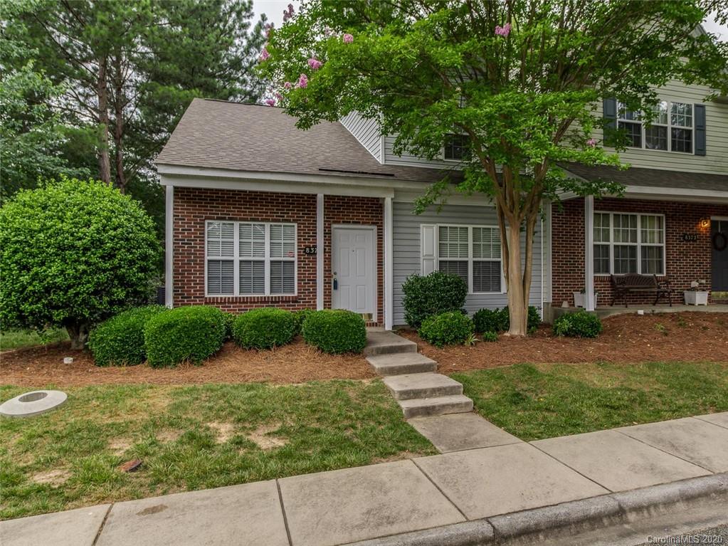8376 Rudolph Road Charlotte, NC 28216 - Photo 1 of 17 a front view of a house with a yard