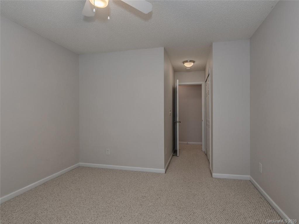 8376 Rudolph Road Charlotte, NC 28216 - Photo 14 of 17 a view of an empty room with a fan