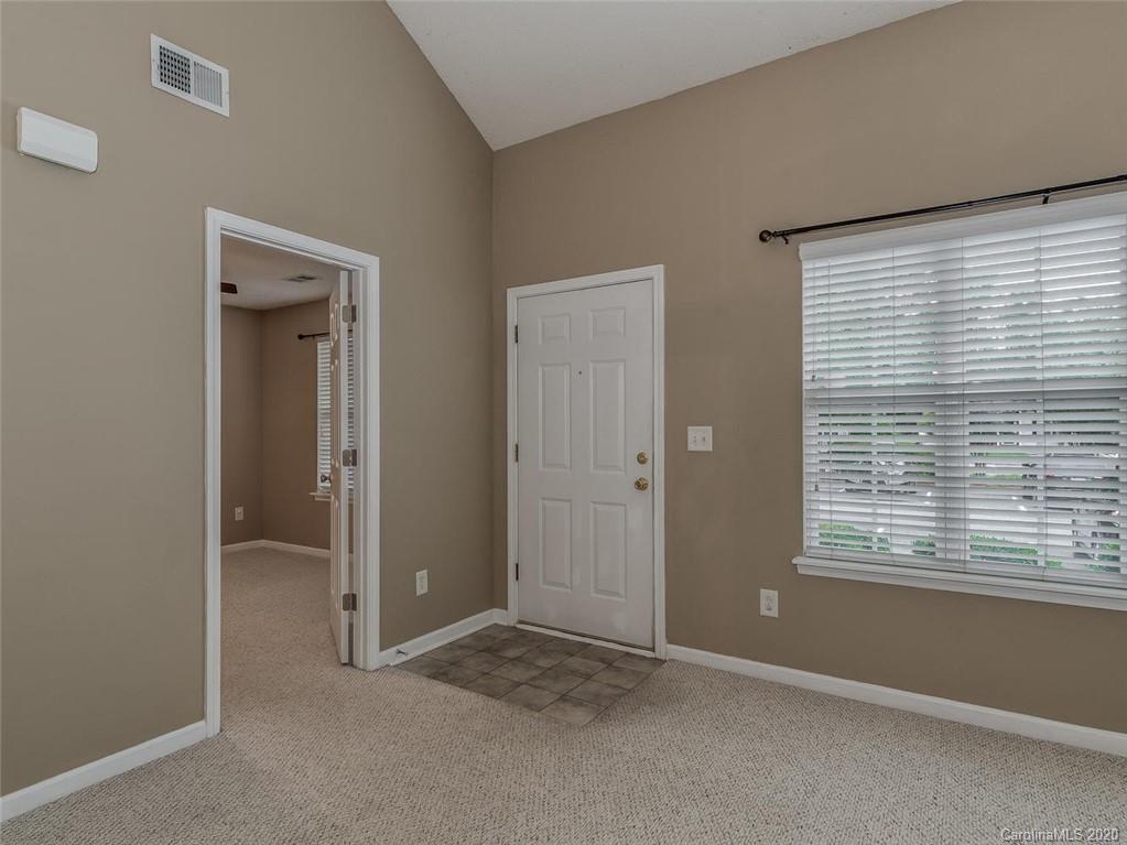 8376 Rudolph Road Charlotte, NC 28216 - Photo 3 of 17 a view of an empty room with closet and a window