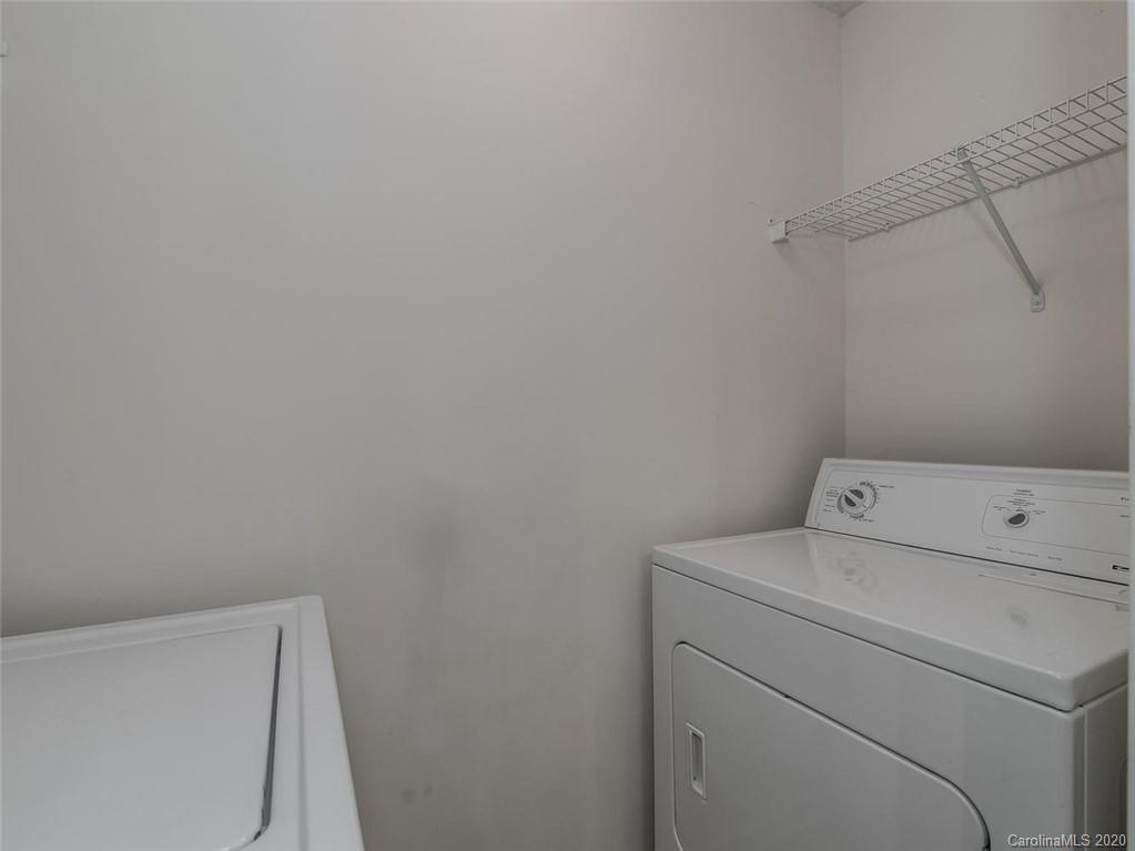 8376 Rudolph Road Charlotte, NC 28216 - Photo 8 of 17 a view of storage and utility room with washer and dryer
