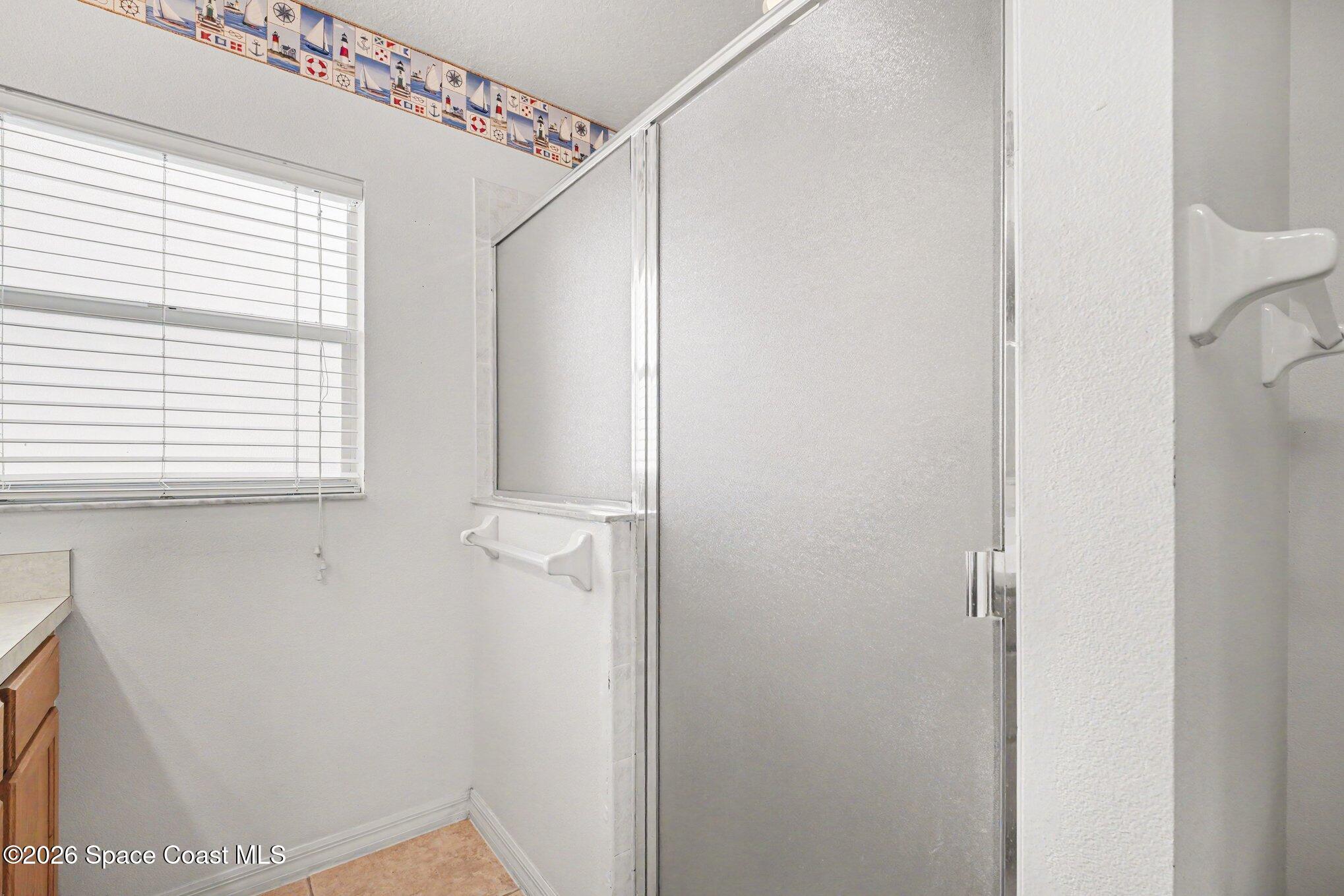 2194 Spring Creek Circle Palm Bay, FL 32905 - Photo 14 of 40 Primary Bathroom.Walk In Shower