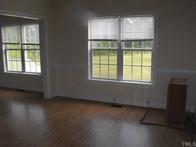 2166 Eldridge Road Newton Grove, NC 28366 - Photo 4 of 11 FORMAL DINING ROOM WITH CHAIR RAILING AND LOTS OF NATURAL LIGHT Dining Room