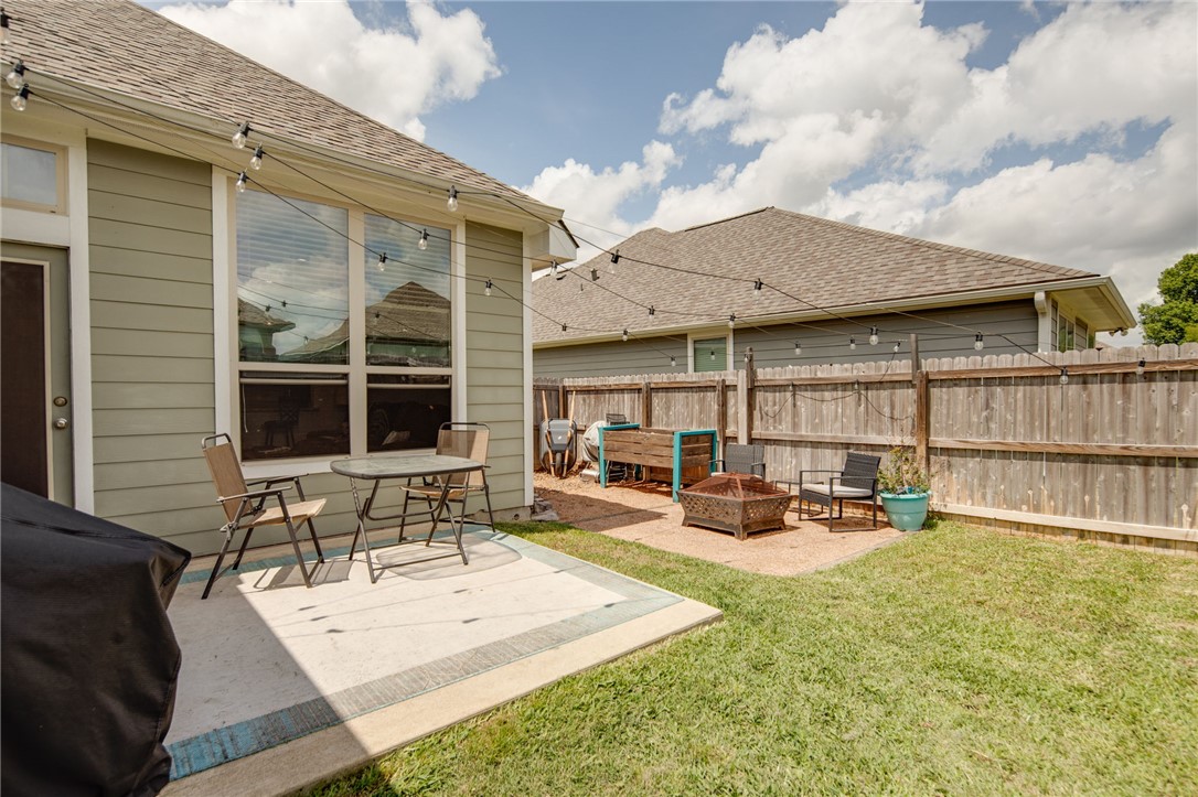 2120 Markley Drive Bryan, TX 77807 - Photo 17 of 21 a view of a patio with table and chairs and wooden fence