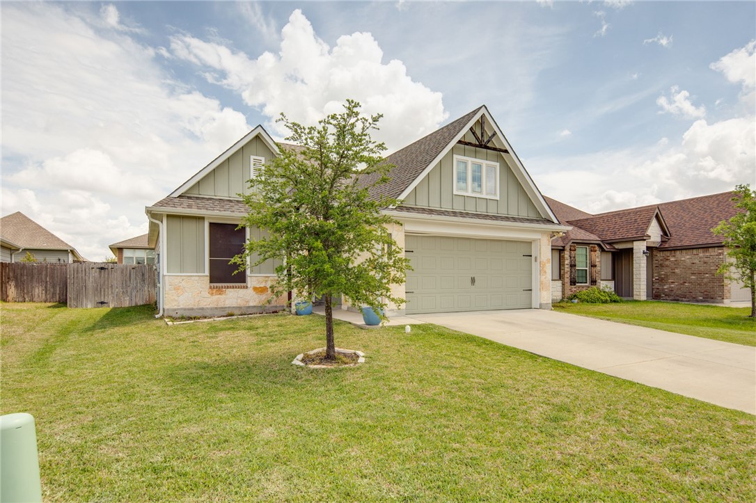 2120 Markley Drive Bryan, TX 77807 - Photo 2 of 21 a front view of a house with a yard garage and outdoor seating