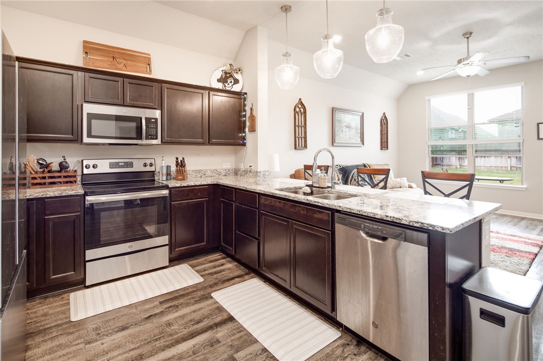 2120 Markley Drive Bryan, TX 77807 - Photo 9 of 21 a kitchen with a sink stove and microwave
