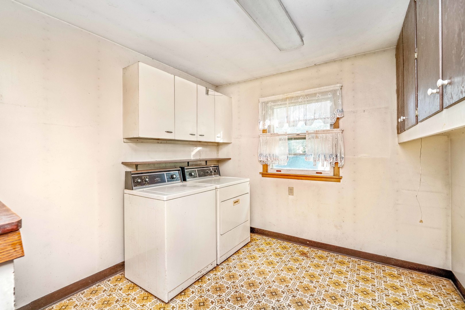 6N731 County Line Road Maple Park, IL 60151 - Photo 17 of 17 a kitchen with a stove a sink and a window
