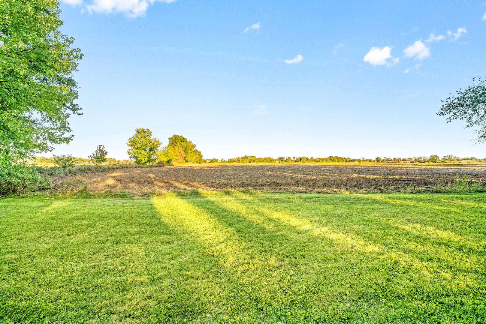 6N731 County Line Road Maple Park, IL 60151 - Photo 4 of 17 a view of an ocean and a yard