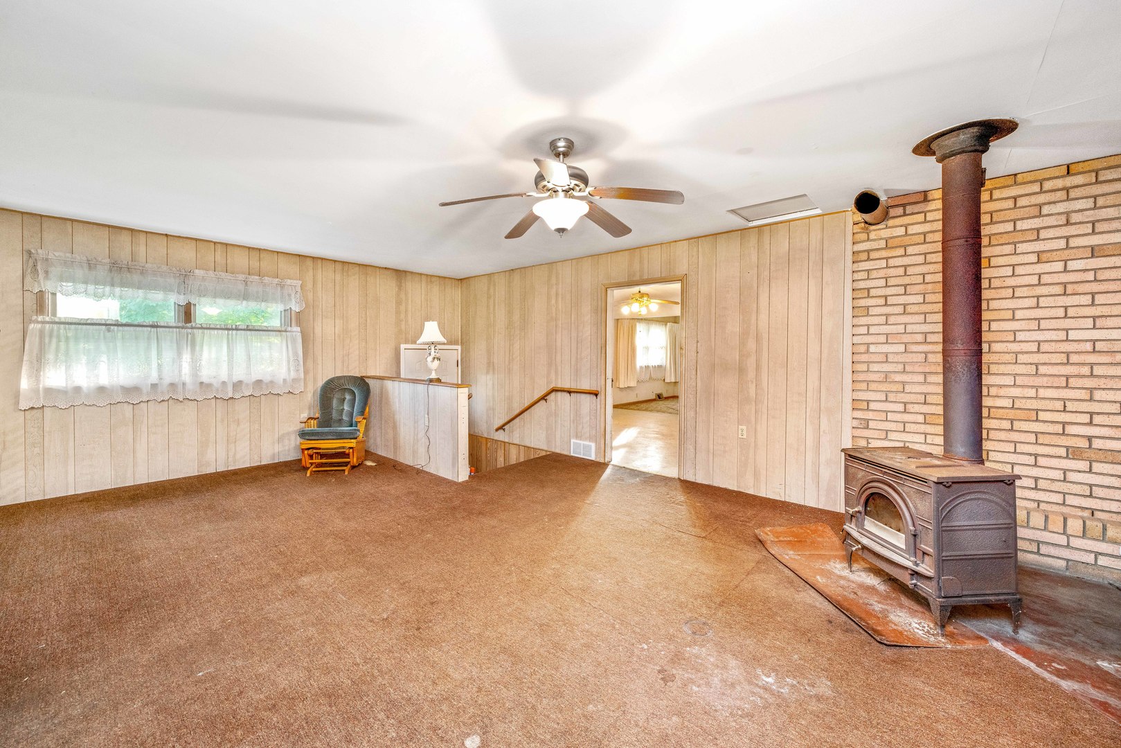 6N731 County Line Road Maple Park, IL 60151 - Photo 7 of 17 a view of a livingroom with a ceiling fan and window
