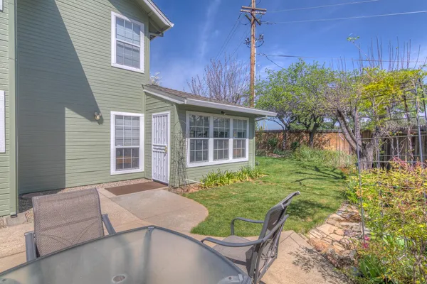 a view of backyard with a garden and plants