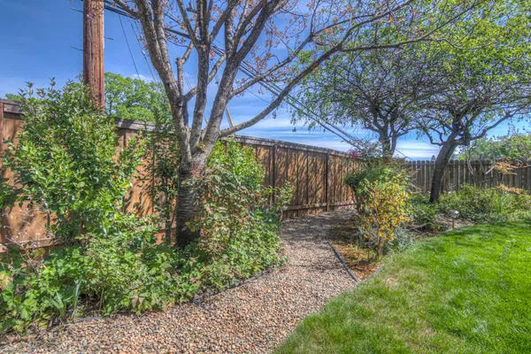 a view of a backyard of the house