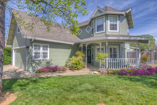 a front view of a house with garden