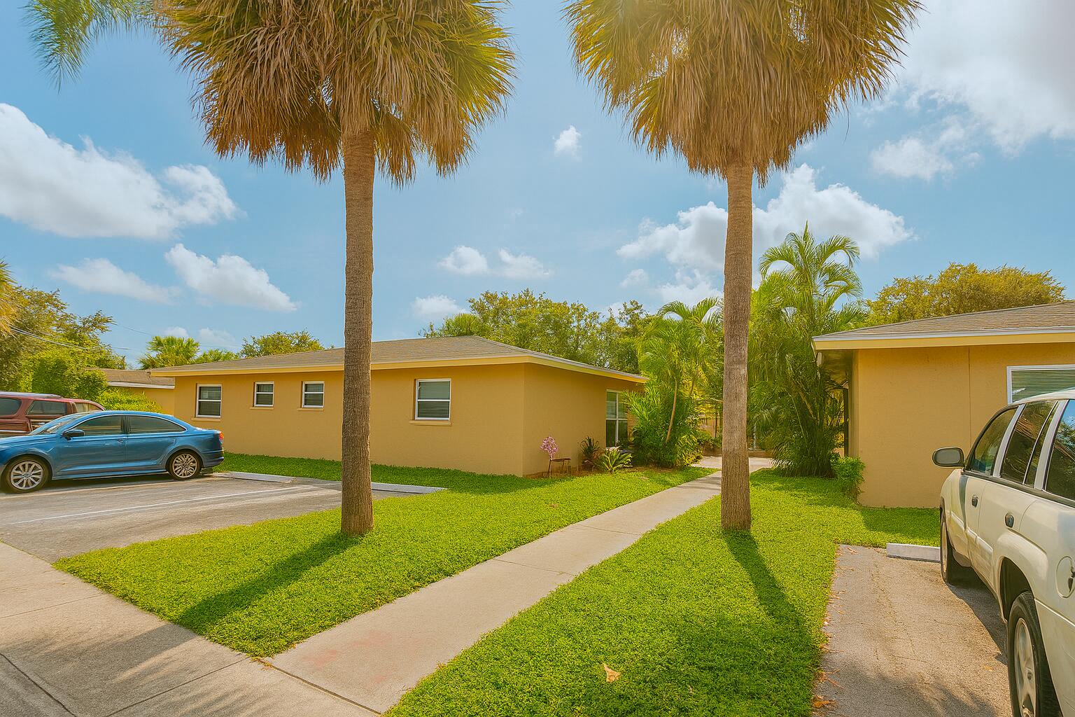 2767 Northwest 58th Terrace Lauderhill, FL 33313 - Photo 1 of 8 a front view of a house with garden and patio