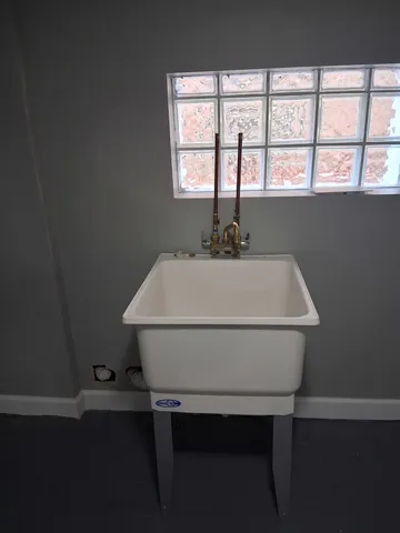 a view of a hallway with seating space