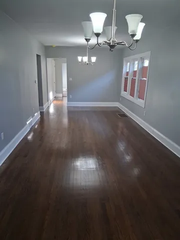 a kitchen with stainless steel appliances wooden cabinets and a sink