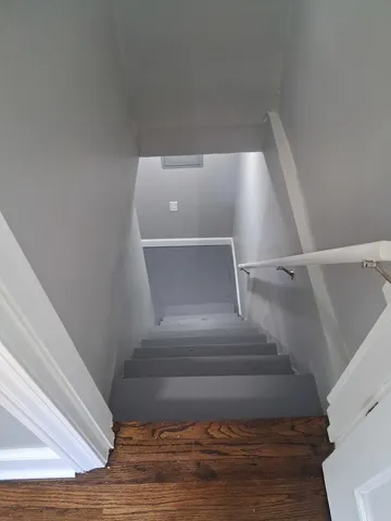 a white toilet sitting next to a bathroom sink