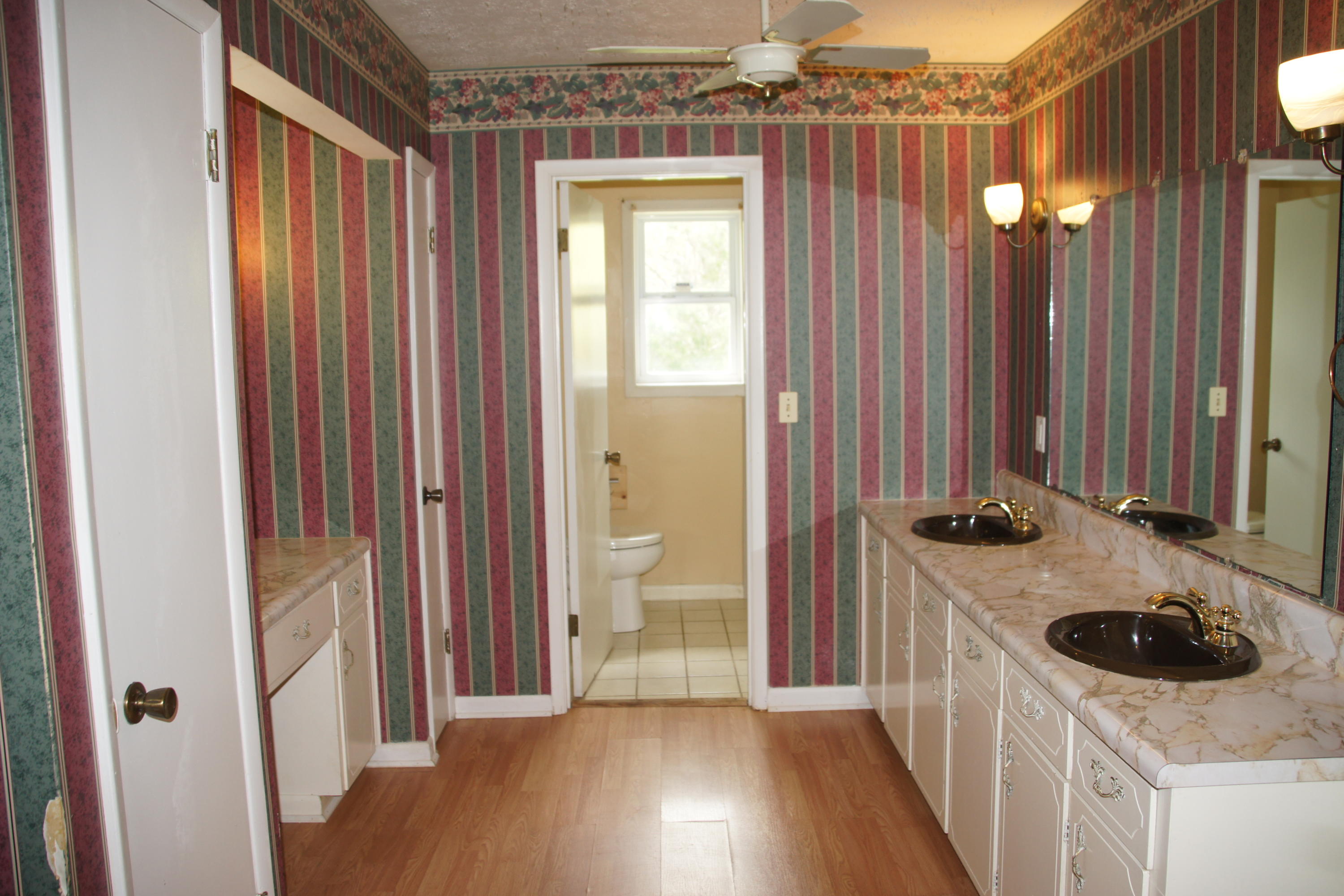 2222 Joy Road Chipley, FL 32428 - Photo 29 of 42 a kitchen with a sink and a stove top oven