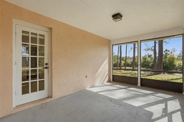 a view of a room with a large window and pool table