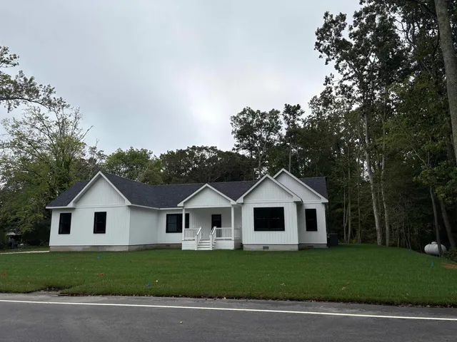 a view of house and a yard