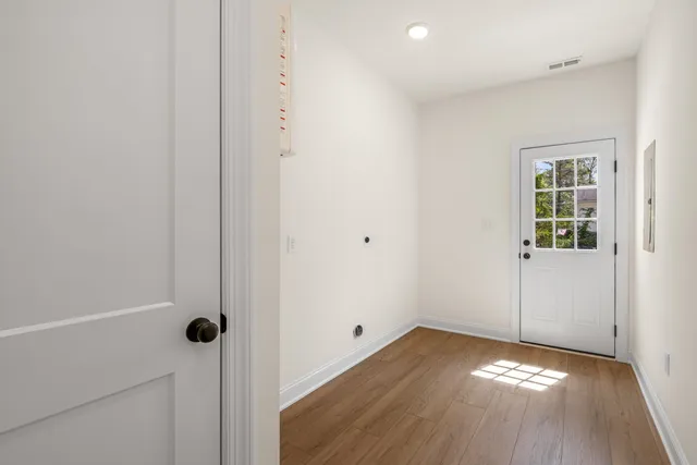 a spacious bedroom with a bed and a window