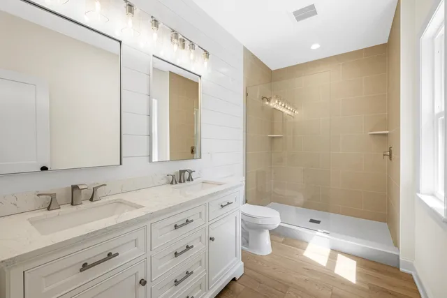 a backyard of a house with barbeque oven table and chairs