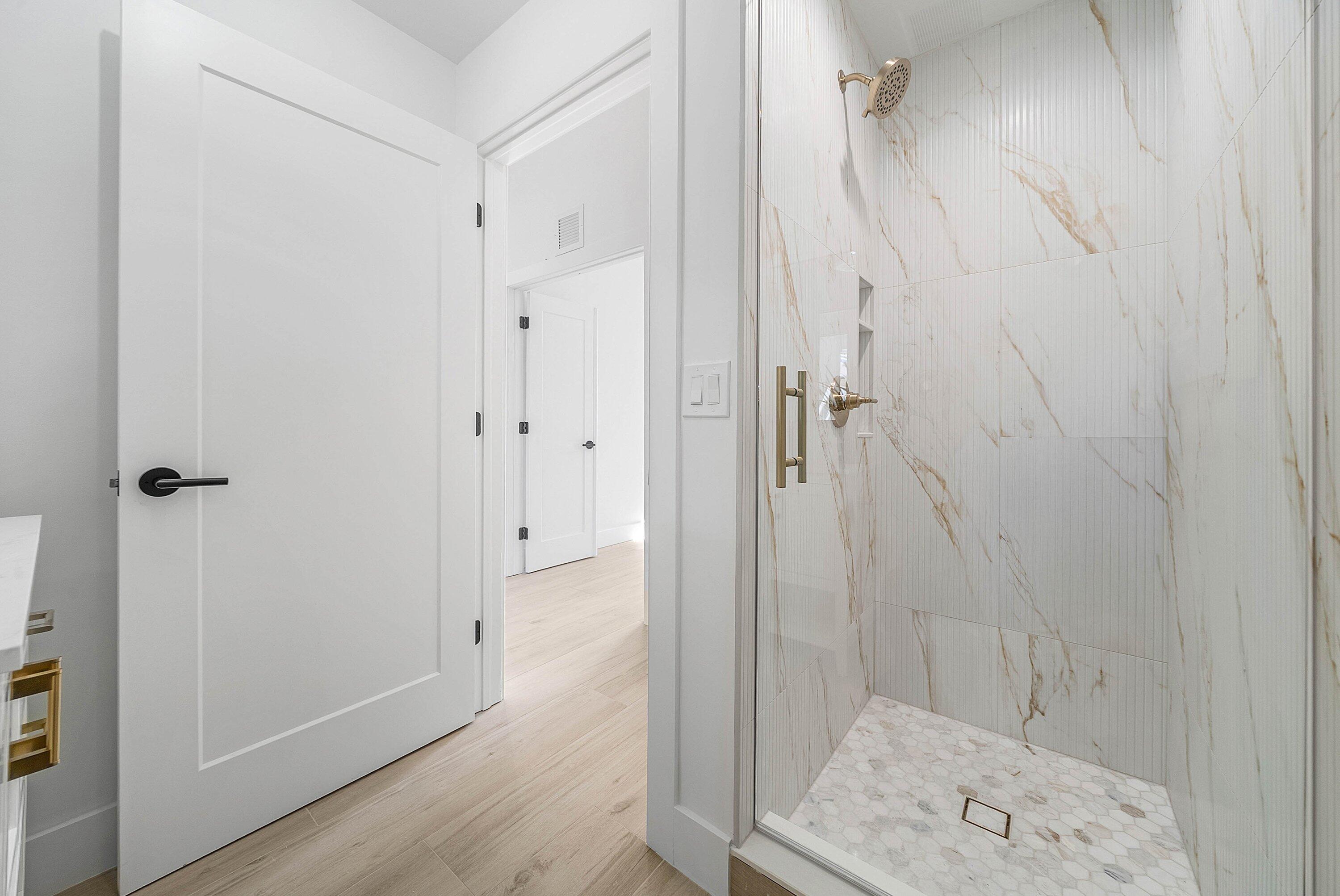 5174 Windsor Parke Drive Boca Raton, FL 33496 - Photo 19 of 55 a bathroom with a shower and a sink