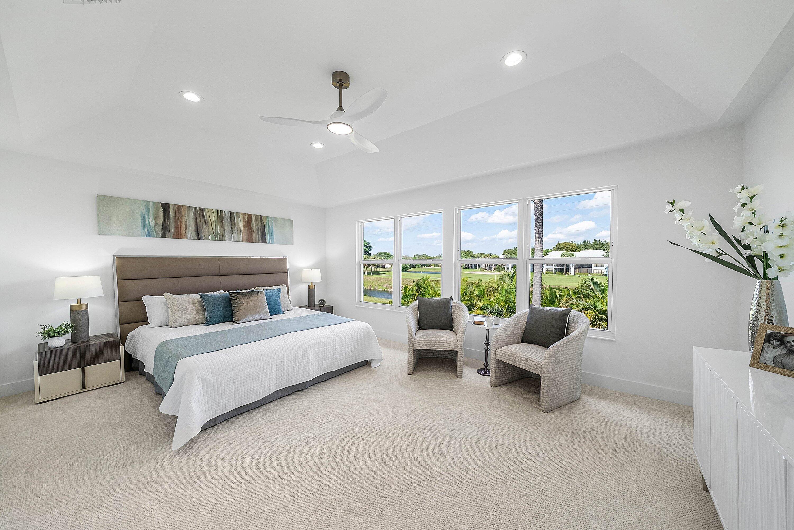 5174 Windsor Parke Drive Boca Raton, FL 33496 - Photo 20 of 55 a bed room with a bed and a large window
