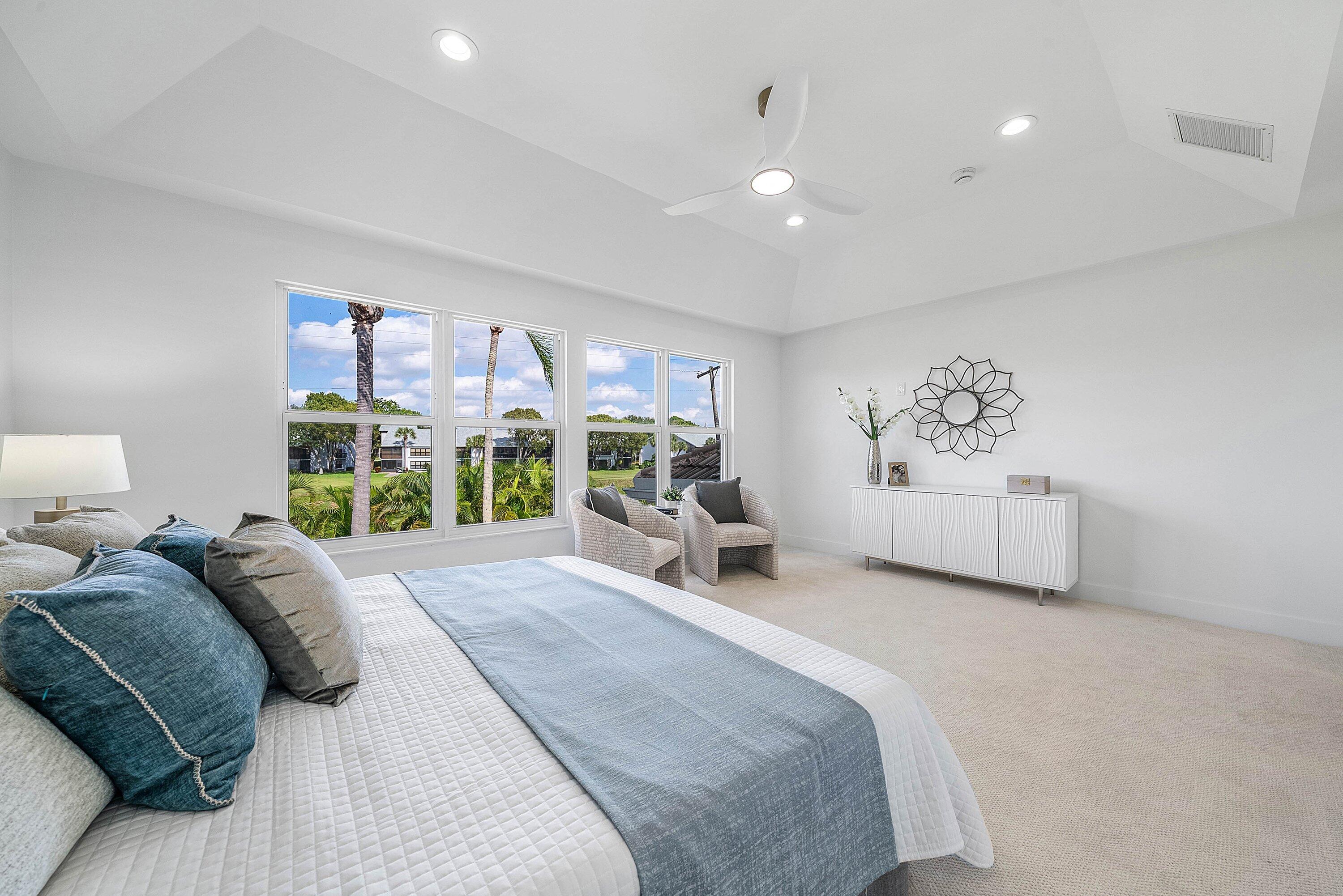 5174 Windsor Parke Drive Boca Raton, FL 33496 - Photo 21 of 55 a bed room with a bed and a large window