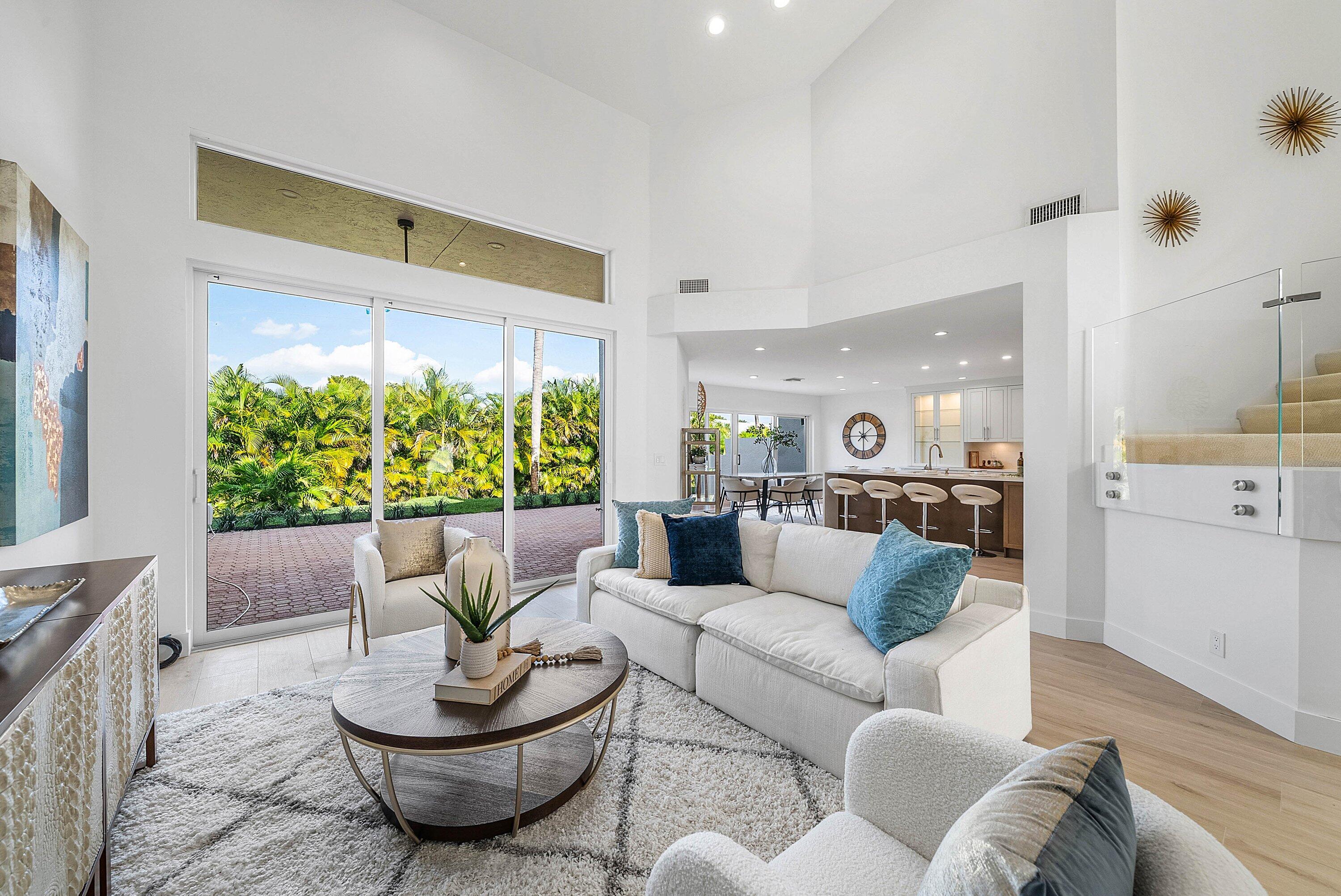 5174 Windsor Parke Drive Boca Raton, FL 33496 - Photo 10 of 55 a living room with furniture and a large window