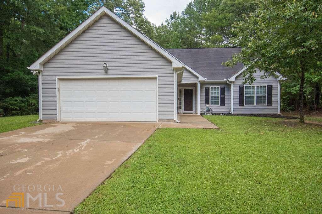 19 Bob Brewster Road Newnan, GA 30263 - Photo 1 of 1 a front view of a house with yard and green space