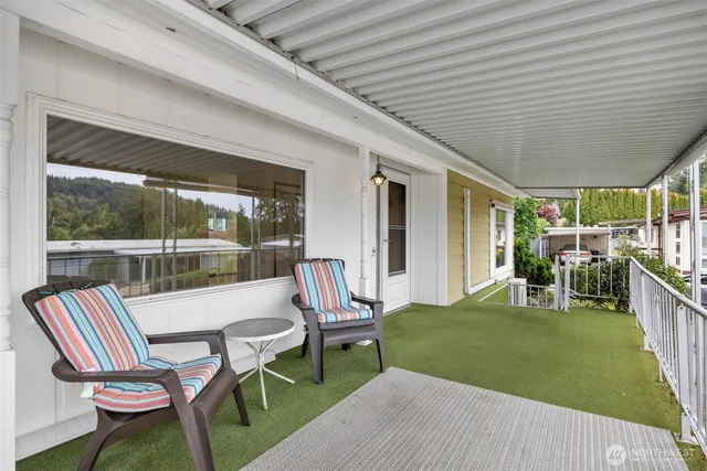 a house view with a sitting space and garden