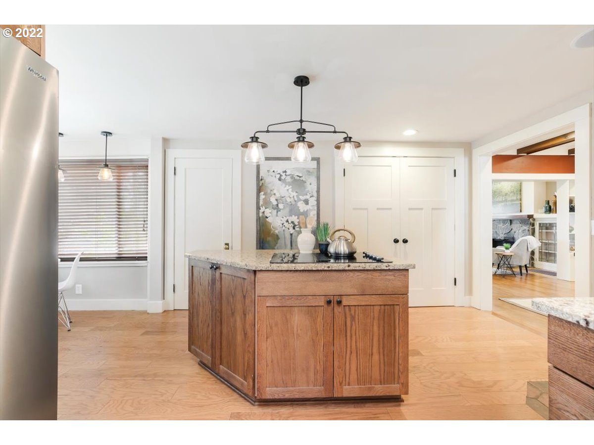 123 Shirley Street Molalla, OR 97038 - Photo 11 of 32 a view of a kitchen with kitchen island granite countertop wooden floor