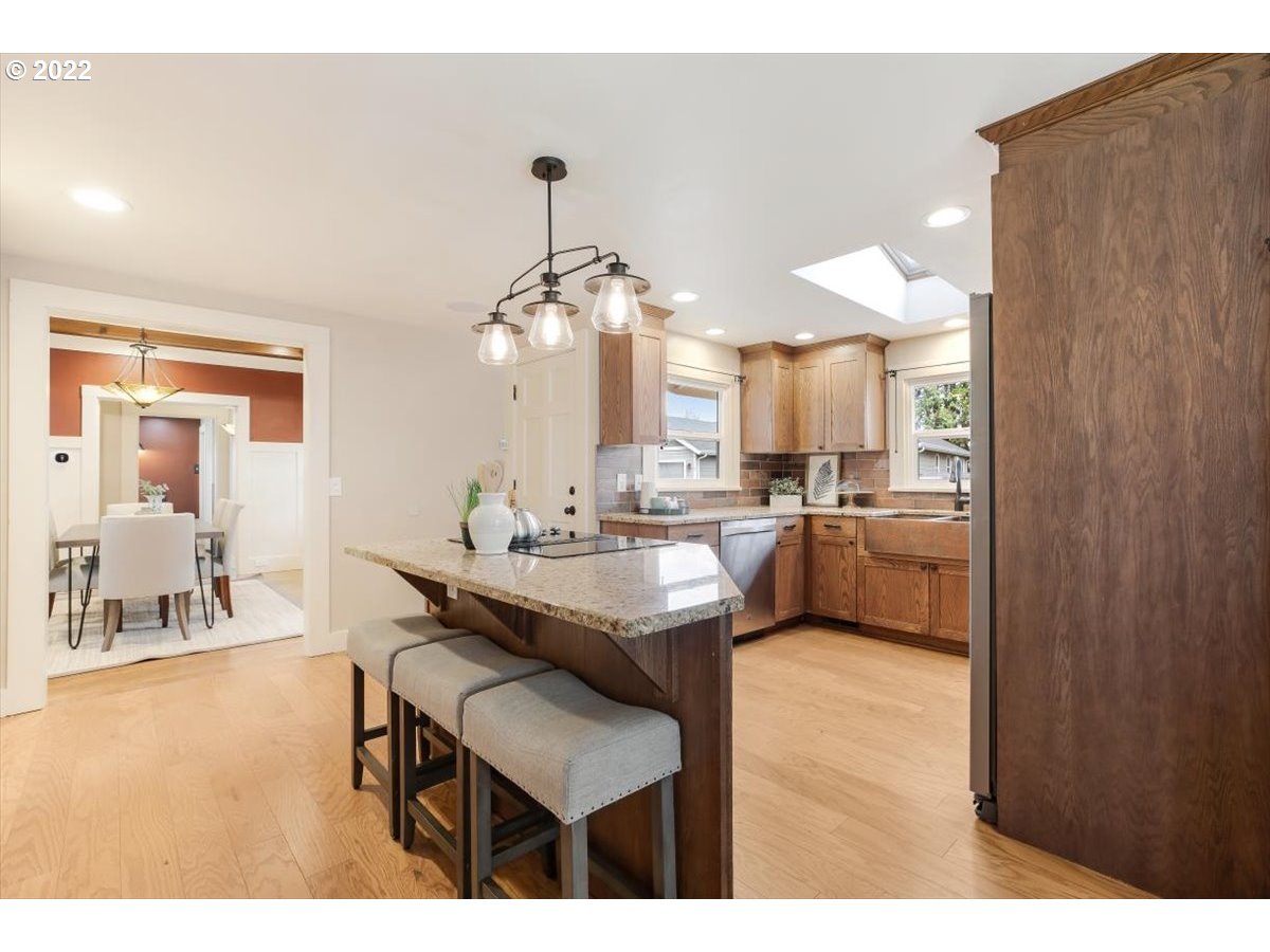123 Shirley Street Molalla, OR 97038 - Photo 12 of 32 a kitchen with a sink and chairs