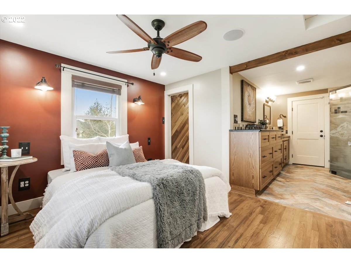 123 Shirley Street Molalla, OR 97038 - Photo 19 of 32 a bedroom with a bed and a large mirror