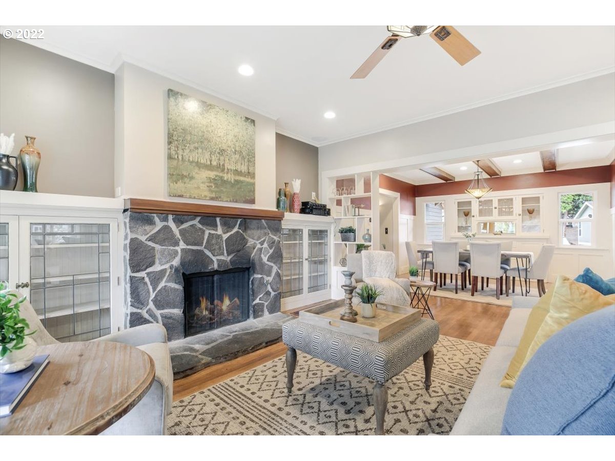 123 Shirley Street Molalla, OR 97038 - Photo 6 of 32 a living room with furniture a fireplace and a large window