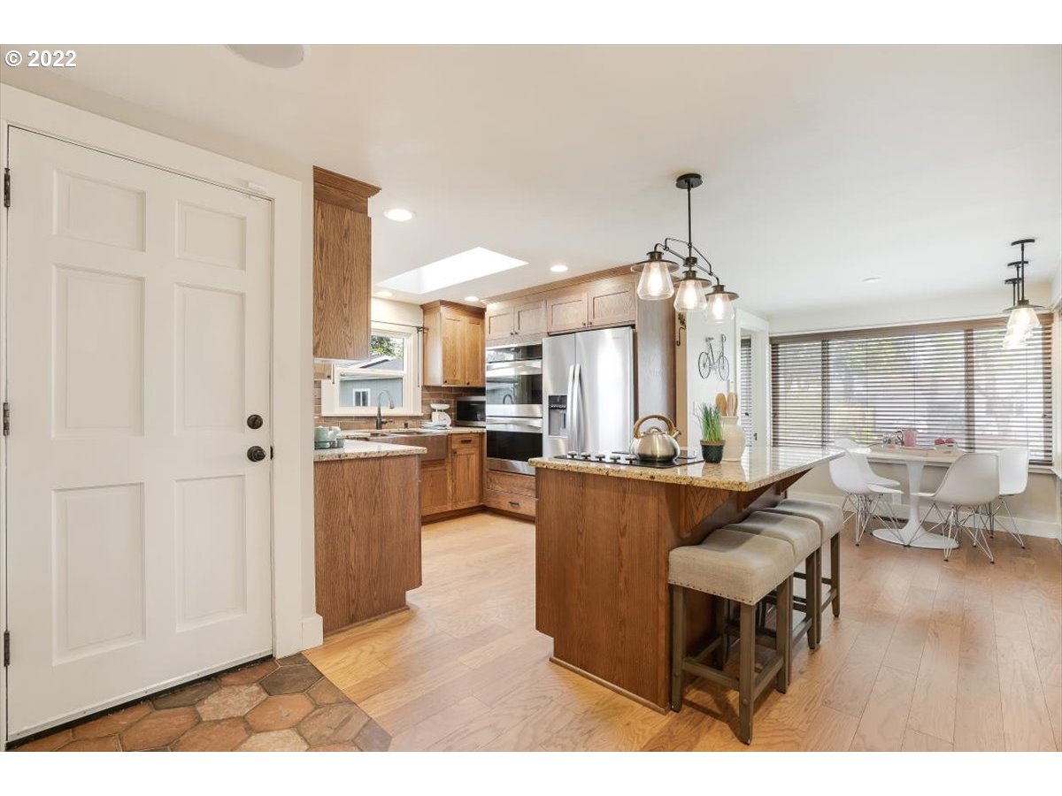 123 Shirley Street Molalla, OR 97038 - Photo 8 of 32 a living room with kitchen island furniture and a chandelier