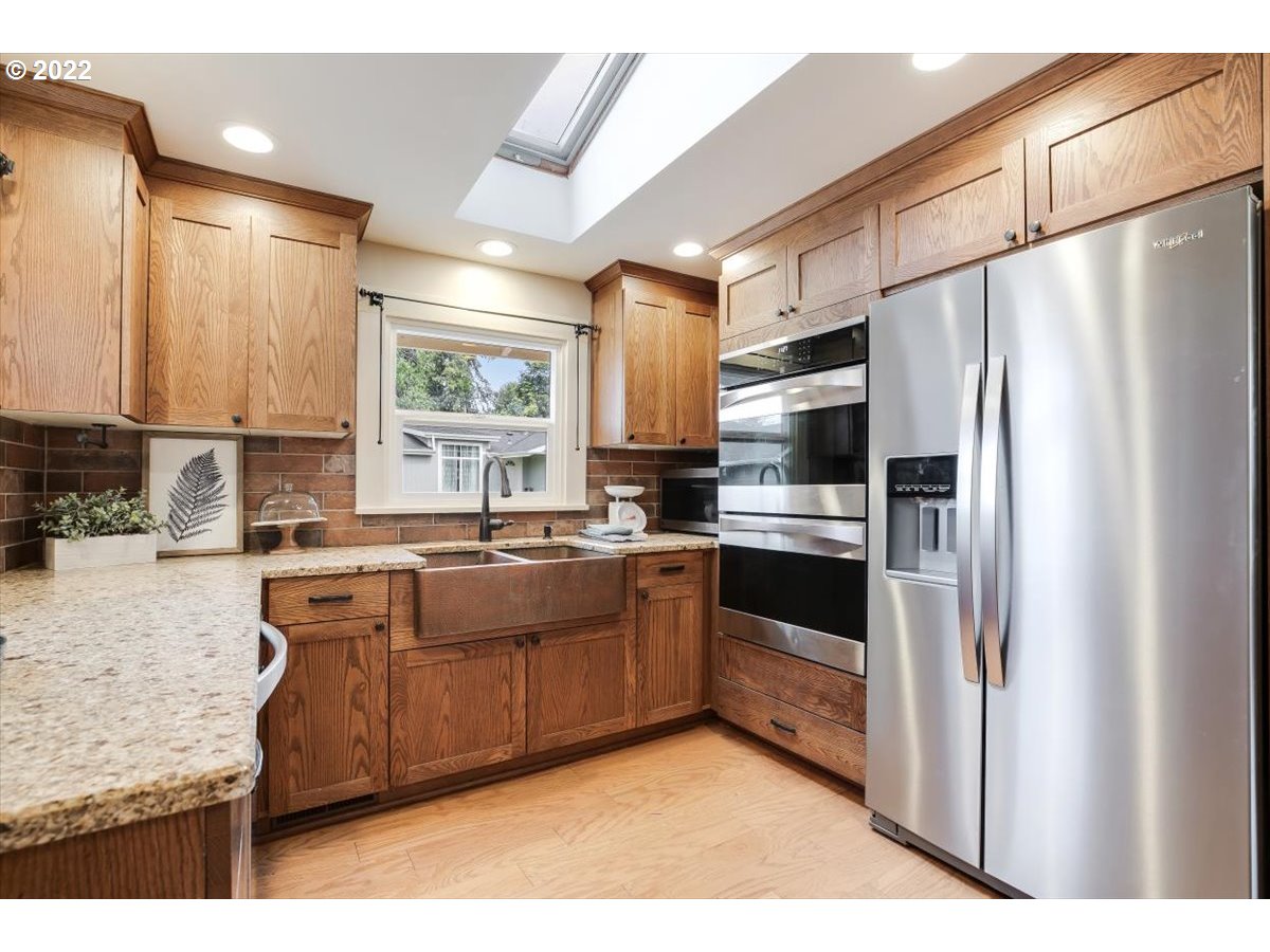 123 Shirley Street Molalla, OR 97038 - Photo 9 of 32 a kitchen with stainless steel appliances granite countertop a refrigerator a sink a stove a microwave and island