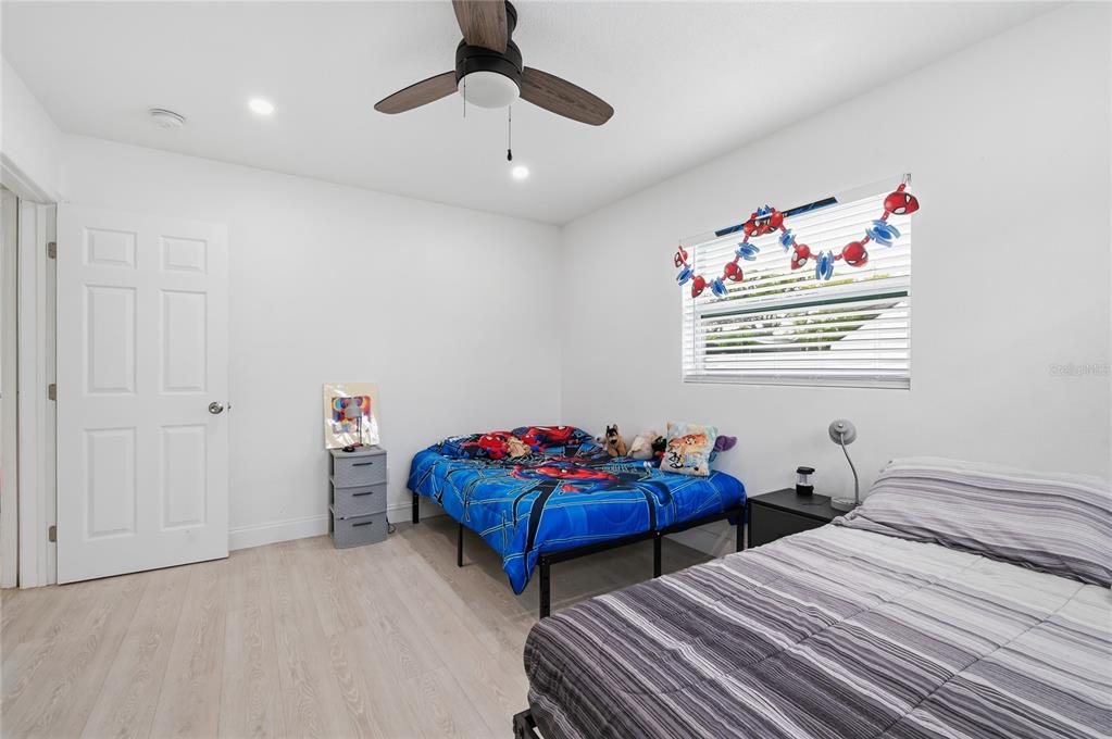 1946 Strathaven Road Winter Park, FL 32792 - Photo 13 of 37 a bedroom with two beds and a chandelier